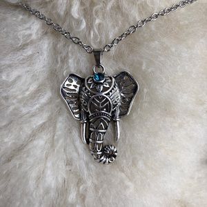 Elegant elephant with blue gemstone necklace